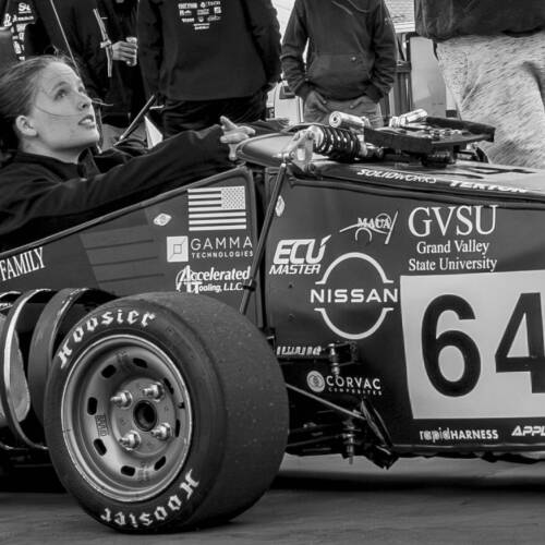 Mechanical Engineering senior Annika Mattson in the Formula SAE car at the 2025 competition.